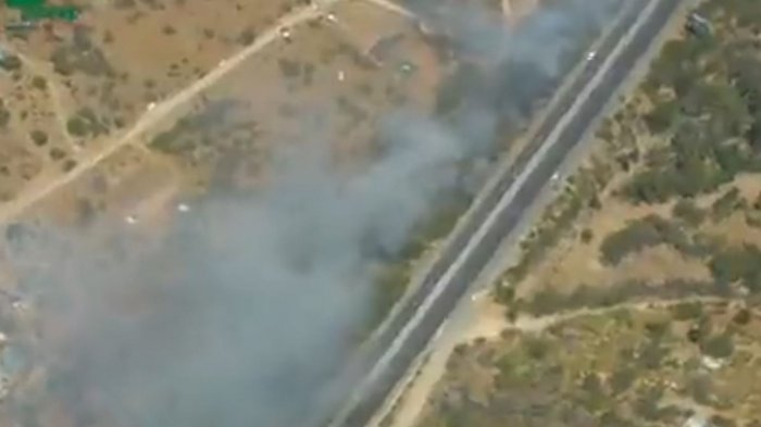 Alerta roja por incendio forestal en Curacaví: Humo disminuye visibilidad en la Ruta 68