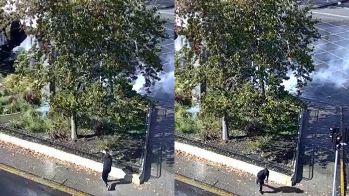 Captan el momento en que encapuchado apuntó con arma a Carabineros durante manifestación del Día del Trabajador